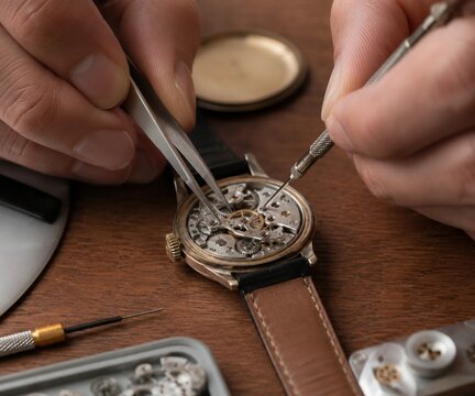 Anonymous Hands Repairing Vintage Mechanical Wristwatch