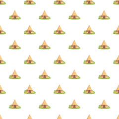 Teepees standing on green grass, forming a repeating pattern for design © nsit0108