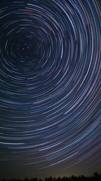 Star trails circling night sky in long exposure time lapse