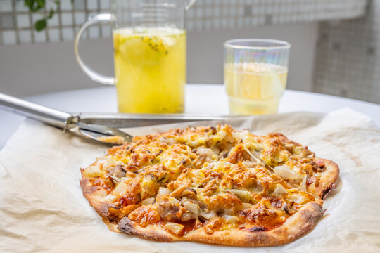 Pizza and juice on the dining table