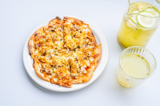 Pizza and juice on the dining table