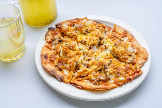 Pizza and juice on the dining table