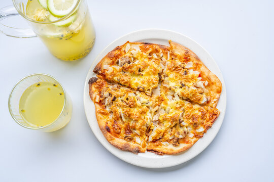 Pizza and juice on the dining table