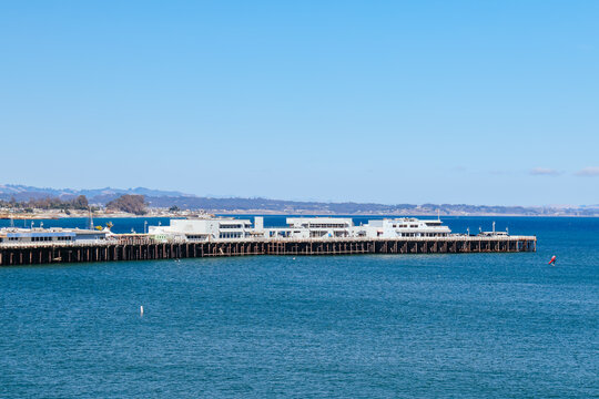 Iconic Santa Cruz Wharf with Boardwalk Buildings on a Clear Sunny Day Overlooking the Pacific Ocean