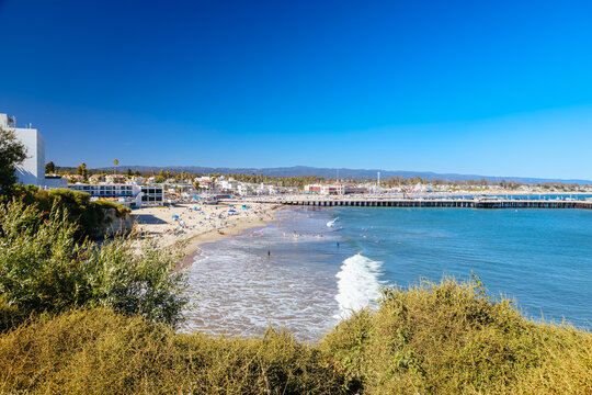 Santa Cruz Beach Boardwalk and Pier Scene with Ocean Waves and Clear Blue Sky