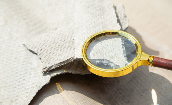 Magnifying glass showing old asbestos. Health problems