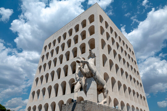 The Palazzo della Civilt&agrave; Italiana - Square Colosseum monument - in the EUR district in Rome. Blue sky with dramatic cloudscape. Rome, Italy - July 4, 2026.Rome, Italy - July 4, 2026.