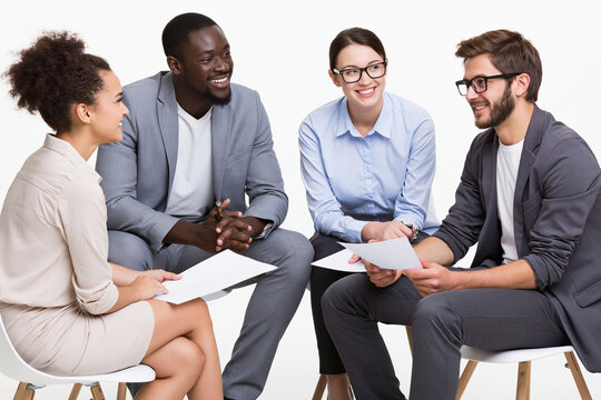 Coworkers Discussing Documents During Business Meeting Isolated on White Background