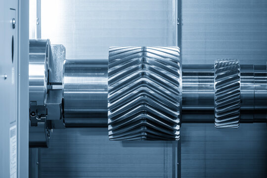 Bevel gear shaft parts during the manufacturing process on a high-precision multi-tasking CNC machine.