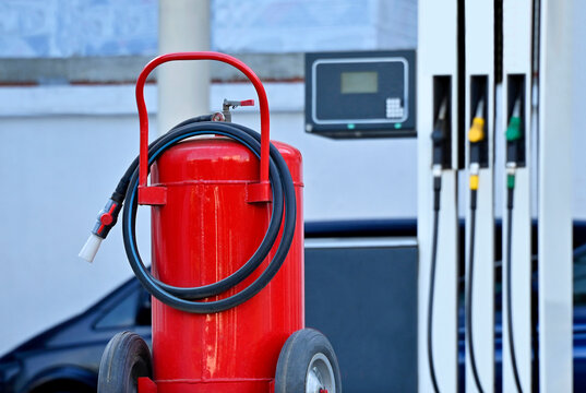 Wheeled trolley fire extinguisher at a gas station