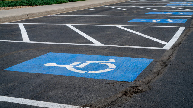 handicapped parking signs on a large lot