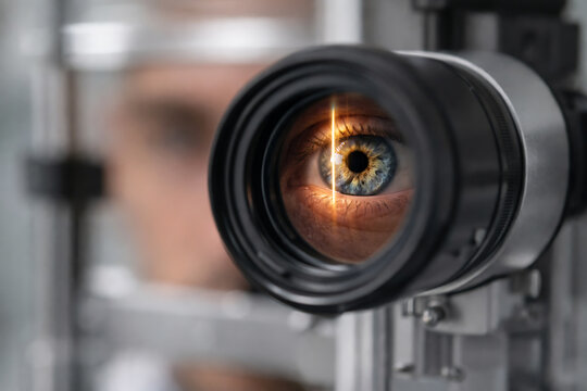 Close up of human eye during precision vision test with ophthalmic scanning equipment