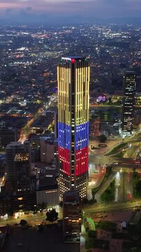 Colpatria Tower At Bogota In District Capital Colombia. Illuminated Downtown. Sunset City Landscape. Bogota At District Capital Colombia. Financial District. Night City Scene.