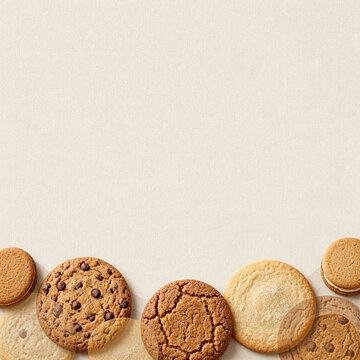 Assorted Cookies Border on Beige Background with Copy Space for Bakery Banner Template