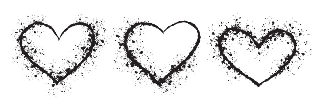 Three splatter heart shapes. Black grunge heart. Spray Painted Graffiti heart sign icon in black over white. Love hearts drip symbol vector illustration. Drawing sketch contour Love silhouettes