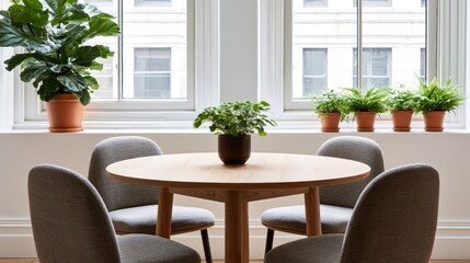 Fototapeta premium Modern round table with chairs and plants in front of windows