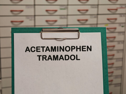 ACETAMINOPHEN TRAMADOL (PARACETAMOL) analgesic and antipyretic for pain and fever displayed on a clipboard in a pharmacy healthcare concept