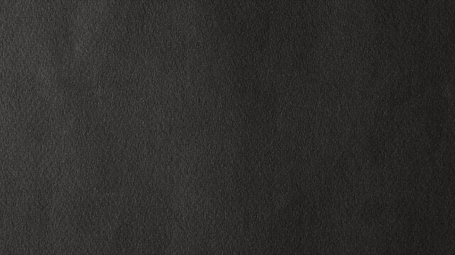 Black paper texture animated background.  Stop motion animated crumpled black paper texture background. Use for background and texture. Black paper background.  4K animated video.