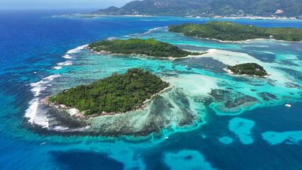 Naklejka premium Saint Anne Island In Victoria Mahe Island Seychelles. Turquoise Ocean Waves Gently Crashing On Tropical Beach. Coast Horizon Seaside Summertime. Coast Panoramic. Victoria Mahe Island.