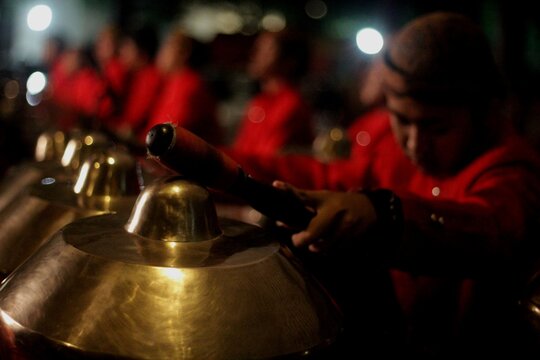 Musician Playing Traditional Javanese Gamelan Percussion Instrument