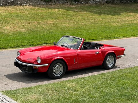 Red 1978 Triumph Spitfire Convertible parked in a rural location. Derbyshire, England, UK. July 2026. 