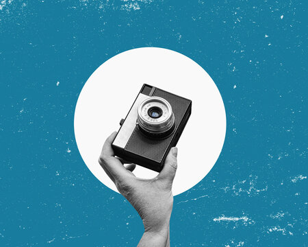 A hand holding retro analog camera. Vintage photo poster. Flat design art collage.