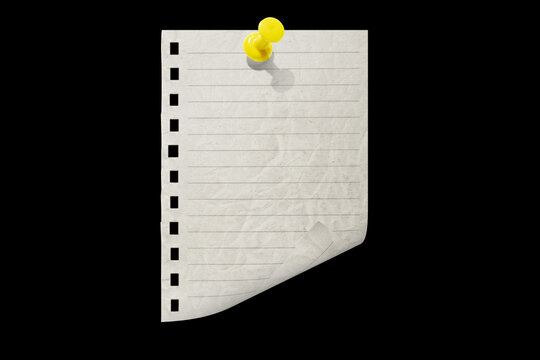 Torn notebook paper attached with a push pin isolated on a black background.