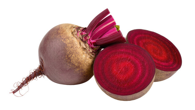 Isolated whole and perfectly sliced raw beetroot, vibrant healthy organic root vegetable.