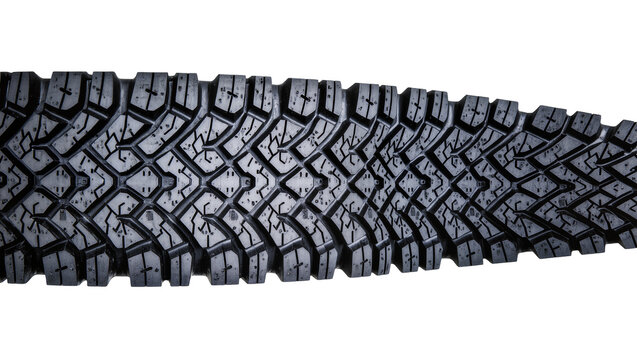 Isolated rugged off-road tire tread pattern made of dark black rubber for automotive use