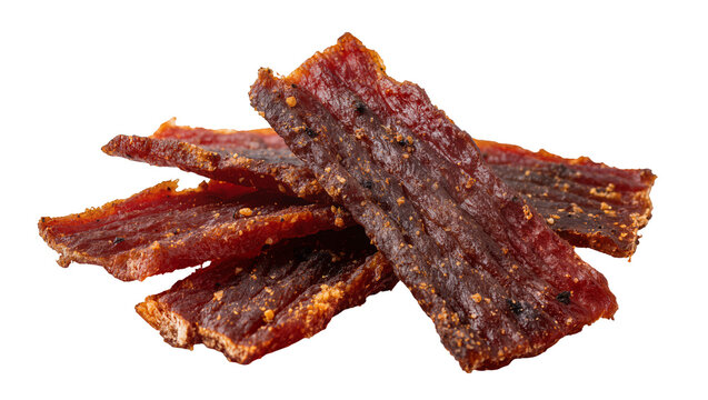 Isolated delicious spicy seasoned beef jerky strips stacked savory protein snack food