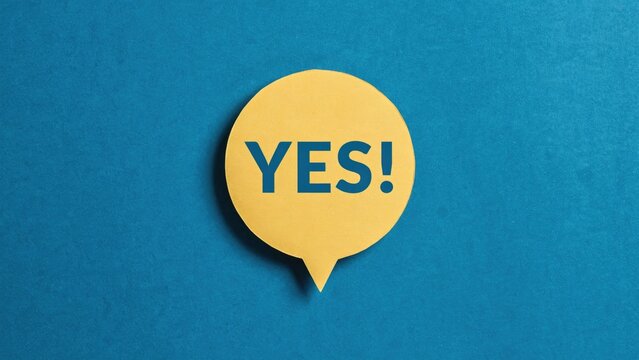 Yellow speech bubble with the word yes printed in blue on a blue background