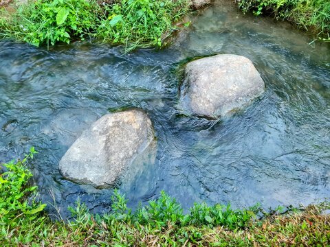 Clear water flowing in small river at the foot of Mount Kelud,located in Blitar,East Java,Indonesia