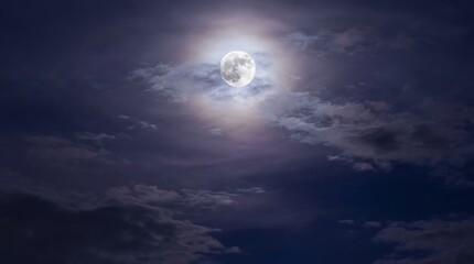Fototapeta premium Full moon glows brightly amidst dramatic clouds at night. A celestial and atmospheric element for cosmic or mystical.