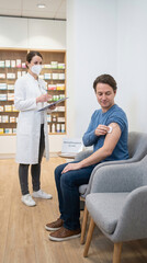 Naklejka premium Pharmacy Vaccination: Patient Receives Shot as Pharmacist Records Details