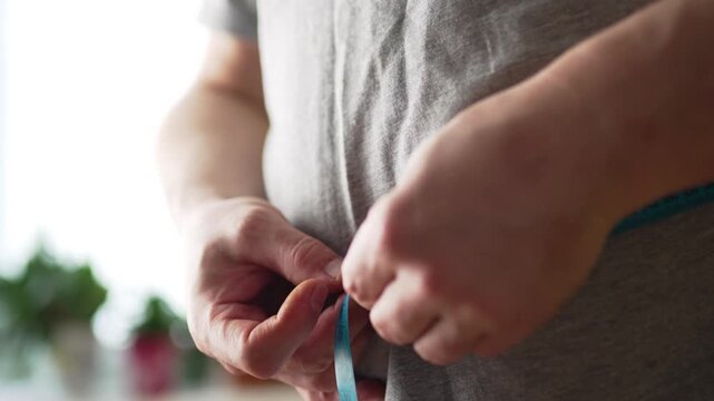 Macro Shot of Measuring Waistline After Exercise
