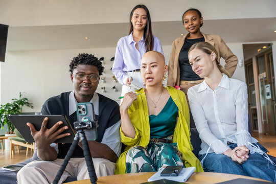 Group of People Discussing Ideas in a Modern Workspace