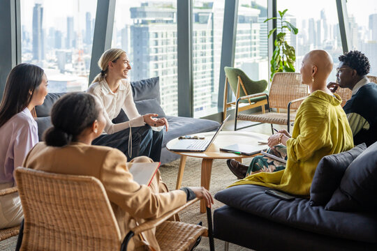 Group Meeting in Office With City View During Daytime