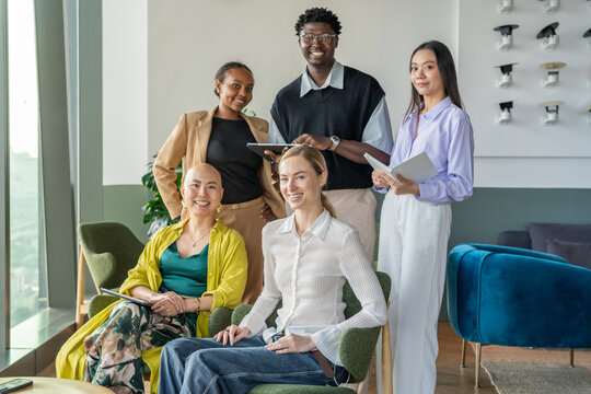 Group Portrait Of Professionals Working Together in a Modern Office