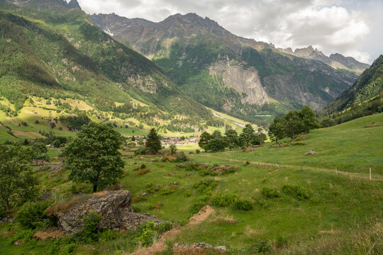 Guttannen, Switzerland. Panoramic view of alpine valley and rugged mountain peaks in the Bernese Oberland