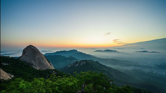 4K Time Lapse Video of Sunrise at Bukhansan Mountain and Morning Sky with Beautiful Sea of Clouds at Bukhansan National Park, Seoul, South Korea.