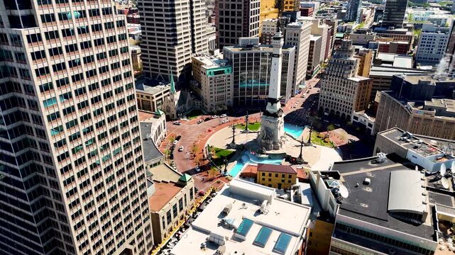 drone footage capturing the heart of Indianapolis, Indiana, showcasing its iconic skyline, contemporary architecture, commercial district, and expansive city layout from a breathtaking perspective abo