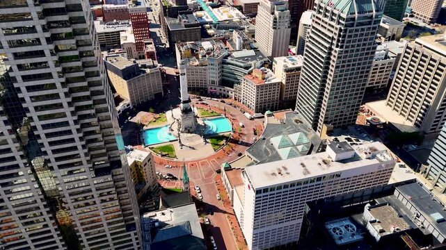 drone footage capturing the heart of Indianapolis, Indiana, showcasing its iconic skyline, contemporary architecture, commercial district, and expansive city layout from a breathtaking perspective abo