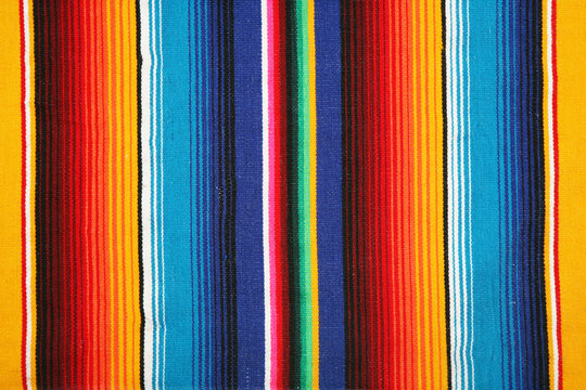 Traditional mexican sarape blanket texture with colorful vertical stripes colorful background tapestry southwest