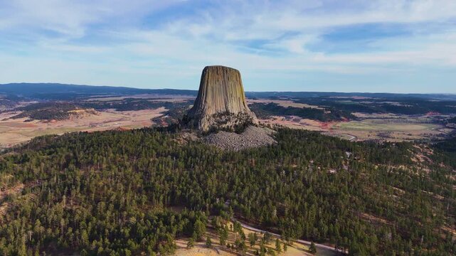 Beautiful aerial footage featuring Devils Tower in Wyoming, highlighting the massive natural rock formation, untouched wilderness, and breathtaking scenery of one of America's most recognizable nation