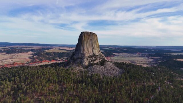 Beautiful aerial footage featuring Devils Tower in Wyoming, highlighting the massive natural rock formation, untouched wilderness, and breathtaking scenery of one of America's most recognizable nation