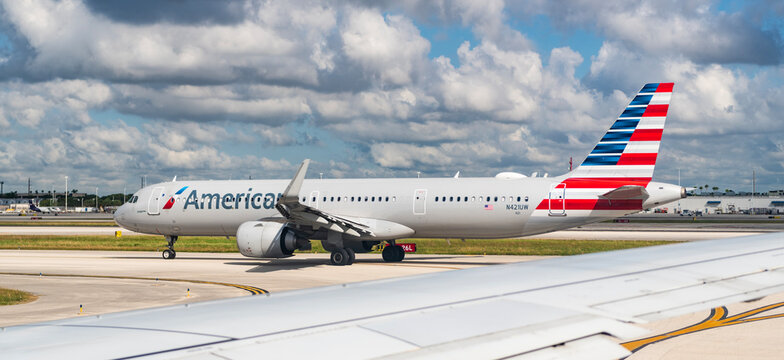 Miami, Florida, USA - October 22, 2025: Plane departure American airline. Departure and arrival at airport. Airplane terminal for airline. American airlines plane departure airport. Airport terminal
