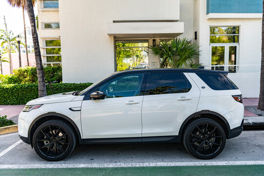 Miami, Florida, USA - July 10, 2025: White car, side view. 2020 Land Rover Discovery Sport SUV car. Luxury SUV sportscar Land Rover Discovery. Car Range Rover Discovery parked outdoor.