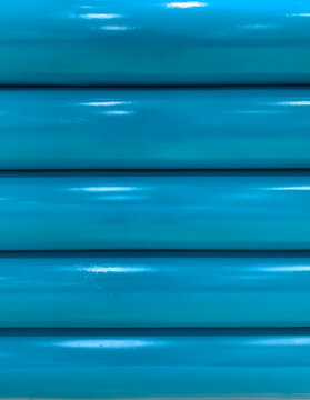 Bright Teal Blue Horizontal Pipes Pattern, Abstract Background Texture with Glossy Reflections and Shadows