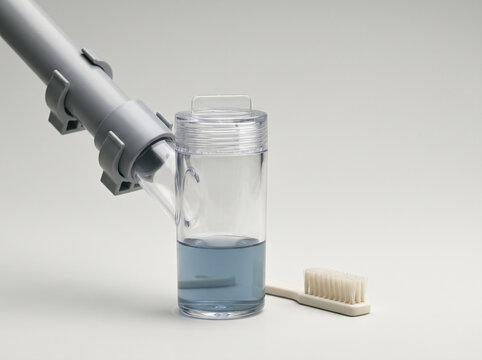Sputum Collector with Cleaning Brush on White Background