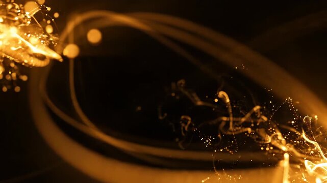 Abstract golden light energy explosion with glowing particles and streaks on black background